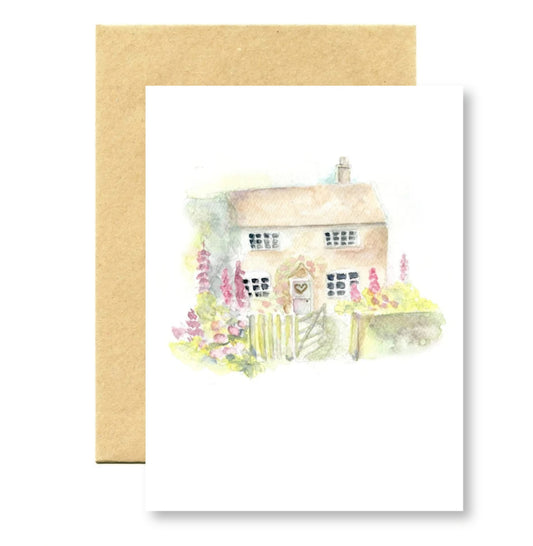 Greeting card with a watercolor illustration of a house and garden on a white background.