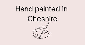Text 'Hand painted in Cheshire' with a paint palette icon on a pink background