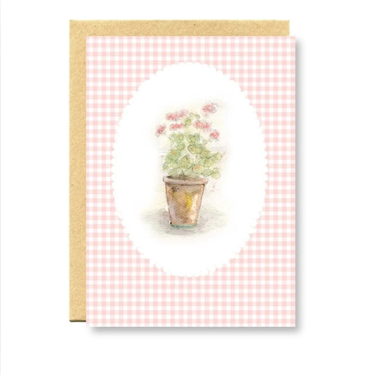 Greeting card with pink checkered border and potted plant illustration on a white background